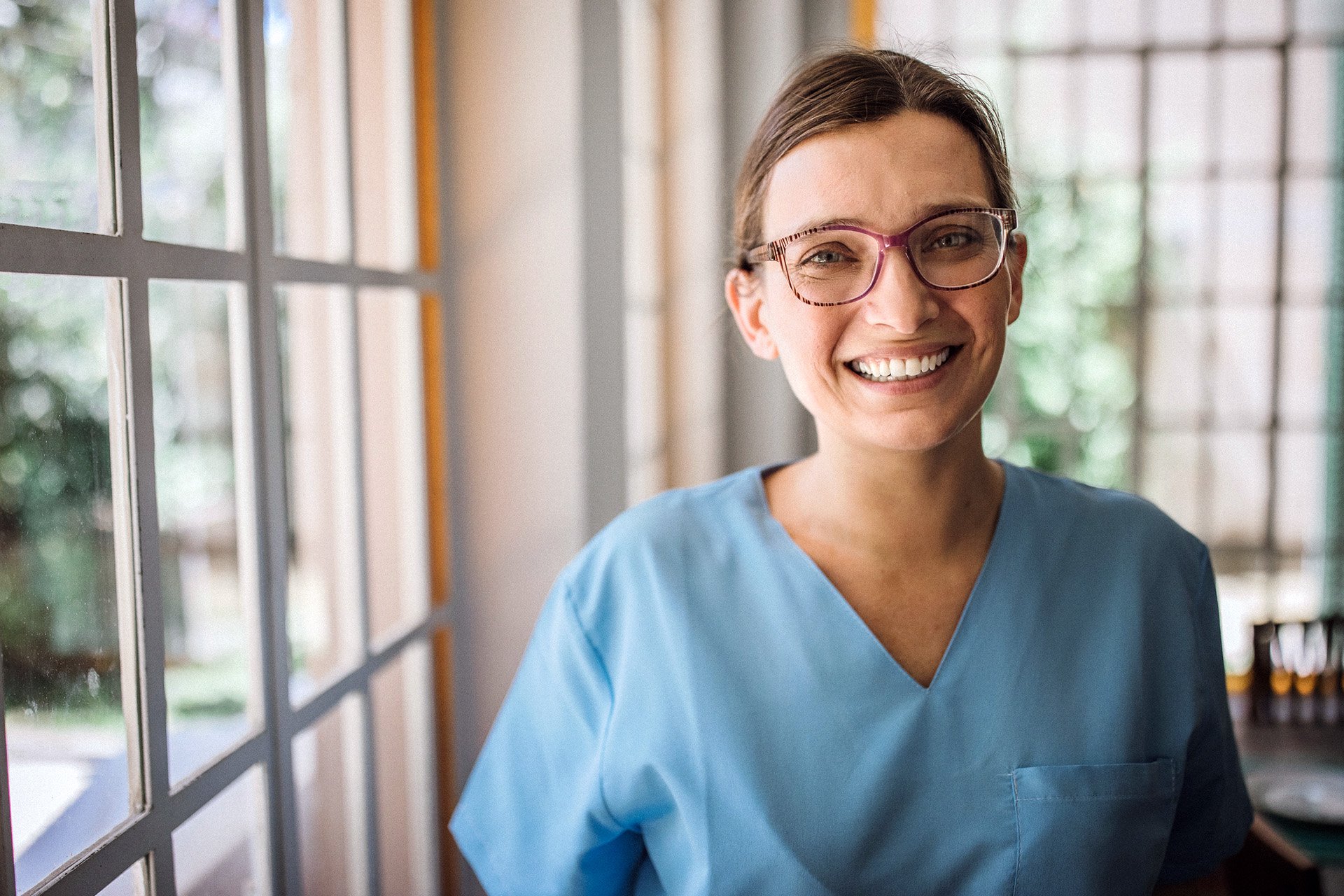 Caregiver-facing-camera-bright-office